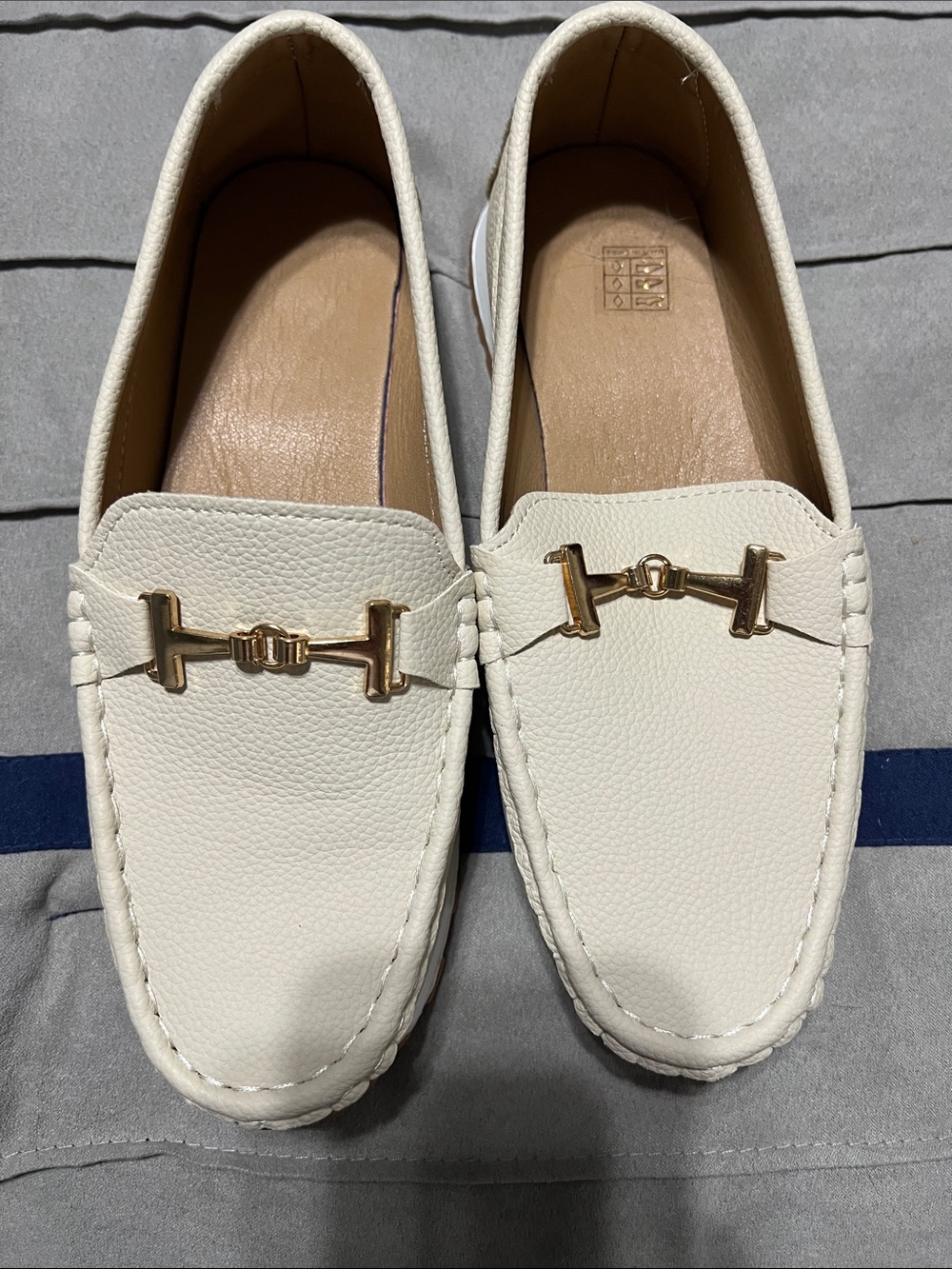 Size 8.5 pebbled cream faux leather loafers with gold accent